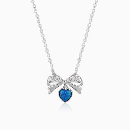 Silver bow necklace with blue opal heart and zircon accents
