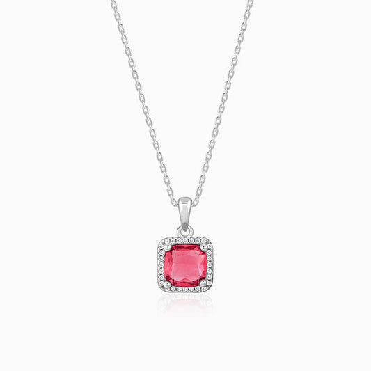 Silver pendant with pink stone and zircon accents on a link chain