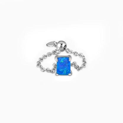 Silver chain ring with blue rectangular opal stone for women from GIVA Sky High collection.

